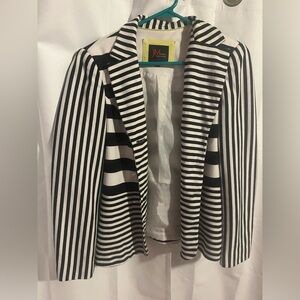 JM studying black and white striped blazer